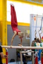 gymnast exercise parallel bars in championship gymnastics, element handstanding