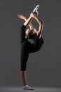 Gymnast girl doing standing backbend Royalty Free Stock Photo