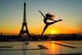 Gymnast jumping against the Eiffel Tower at dawn Royalty Free Stock Photo