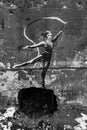 Gymnast with ribbon - Banksy graffiti in Irpin, Ukraine, black and white photo