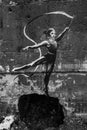 Gymnast with ribbon - Banksy graffiti in Irpin, Ukraine, black and white photo