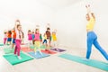 Gymnastic coach teaching kids stretching hands Royalty Free Stock Photo