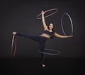 Gymnastic exercises with hula Hoop girl performs a circus artist.