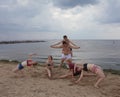 Gymnastic pyramid. youth fun games on the beach.