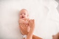 Gymnastics baby. woman doing exercises with child for its development