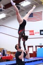 Gymnastics coach and athlete doing acrobatics