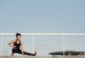 Gymnastics, pilates and fitness outdoors. African american girl in sportswear doing warm-up Royalty Free Stock Photo