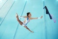 Gymnastics, woman with ribbon for dance and performance, flexibility with professional athlete in gym and top view Royalty Free Stock Photo