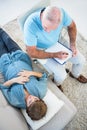 Gynaecologist examining pregnant woman at home Royalty Free Stock Photo