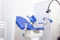 Gynecological cabinet in clinic hospital with blue chair and other medical equipment. Woman health, newborn and Royalty Free Stock Photo
