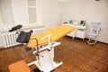 Gynecological chair in the clinic for artificial insemination and reproduction of women. Couch and medical equipment for