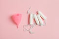 menstruation products to choose, pink silicone menstrual cup and cotton tampons for critical days, zero waste and healthy lifestyl