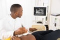 Gynecologist Checking Pregnant Woman`s With Ultrasound Royalty Free Stock Photo