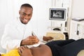 Gynecologist Checking Pregnant Woman`s With Ultrasound Royalty Free Stock Photo