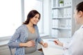 Gynecologist doctor and pregnant woman at hospital Royalty Free Stock Photo