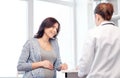 Gynecologist doctor and pregnant woman at hospital Royalty Free Stock Photo