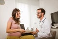 Gynecologist doctor and pregnant woman meeting at hospital Royalty Free Stock Photo