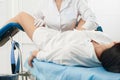 Cropped panorama of gynecologist examining a patient who is sitting in a gynecological chair. Female health concept. Royalty Free Stock Photo