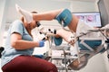 Gynecologist examining female patient with colposcope. Royalty Free Stock Photo