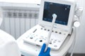 The gynecologist holds the sensor of the ultrasound device with the gel applied in his hand. for inspection of the pelvic organs