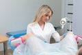 A gynecologist performs a colposcopy on a young girl in a gynecological chair in a modern medical office. Prevention and Royalty Free Stock Photo