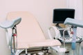 Gynecologist`s chair and ultrasound machine close-up. Gynecology concept Royalty Free Stock Photo