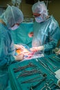 Gynecologist sews a stomach back together after a caesarean section Royalty Free Stock Photo