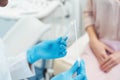 Gynecologist testing vaginal swab for STD