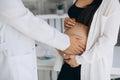 Gynecology consultation. Pregnant woman with her doctor in clinic Royalty Free Stock Photo