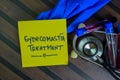 Gynecomastia Treatment write on sticky notes isolated on Wooden Table