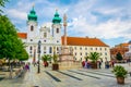 GYOR, HUNGARY MAY 20, 2016: People are walking in front of the Benedictine Loyolai Szent Ignac Church on szechenyi