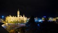 Gyor, Hungary, town hall and square on a dark midnight after rain, blurred car lights on road, long exposure image