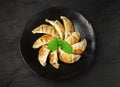 Gyoza Chinese Dumplings Top View, Vegetable Jiaozi, Chicken Momo Pile, Asian Gyoza Portion on Black