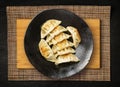 Gyoza Chinese Dumplings Top View, Vegetable Jiaozi, Chicken Momo Pile, Asian Gyoza Portion on Black Royalty Free Stock Photo