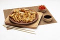 Gyoza dumplings on ceramic plate. Chopsticks on table. Two bowls with soy sauce and pickled ginger Royalty Free Stock Photo