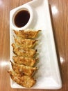 Gyoza janpanese pan fried pork dumplinges on plate and sauce. Royalty Free Stock Photo