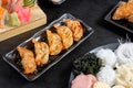 Gyoza and spicy sacue on black dise Royalty Free Stock Photo