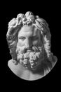 Gypsum copy of ancient statue Zeus head isolated on black background. Plaster sculpture man face. Royalty Free Stock Photo