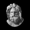 Gypsum copy of antique statue Zeus head isolated on black background. Plaster sculpture man face with beard. Royalty Free Stock Photo