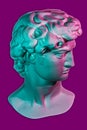 Gypsum copy of head statue David for artists. Plaster face of sculpture youth David before fight with giant Goliath by