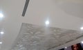 Gypsum false ceiling and coves for indirect lighting in which beautiful flora designs are made with some light materials which Royalty Free Stock Photo