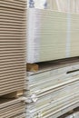 Gypsum plasterboard in the pack. The stack of gypsum board preparing for construction. Pallet with plasterboard in the building Royalty Free Stock Photo