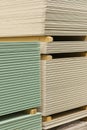 Gypsum plasterboard in the pack. The stack of gypsum board preparing for construction. Pallet with plasterboard in the building Royalty Free Stock Photo