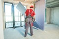 Gypsum plasterboard work. Drywall construction at home. Contractor worker installing wall Royalty Free Stock Photo