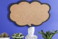 gypsum statue and plants with blank sign on blue background. copy space, advertisement, presentation.