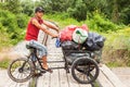 Gypsy boy riding on a bicycle Royalty Free Stock Photo