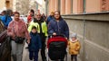 BRNO, CZECH REPUBLIC, FEBRUARY 29, 2020: Gypsy family mother with pram stroller children and baby action band dance music street,