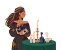 Gypsy Woman as Fortune Teller Holding Tarot Cards at Table with Candle Predicting Future or Performing Occult Ritual Royalty Free Stock Photo