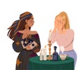 Gypsy Woman as Fortune Teller Holding Tarot Cards at Table with Candle Predicting Future to Girl or Performing Occult
