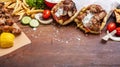 Gyro pita, shawarma, souvlaki. Two pita bread wraps and meat skewers on wooden table Royalty Free Stock Photo